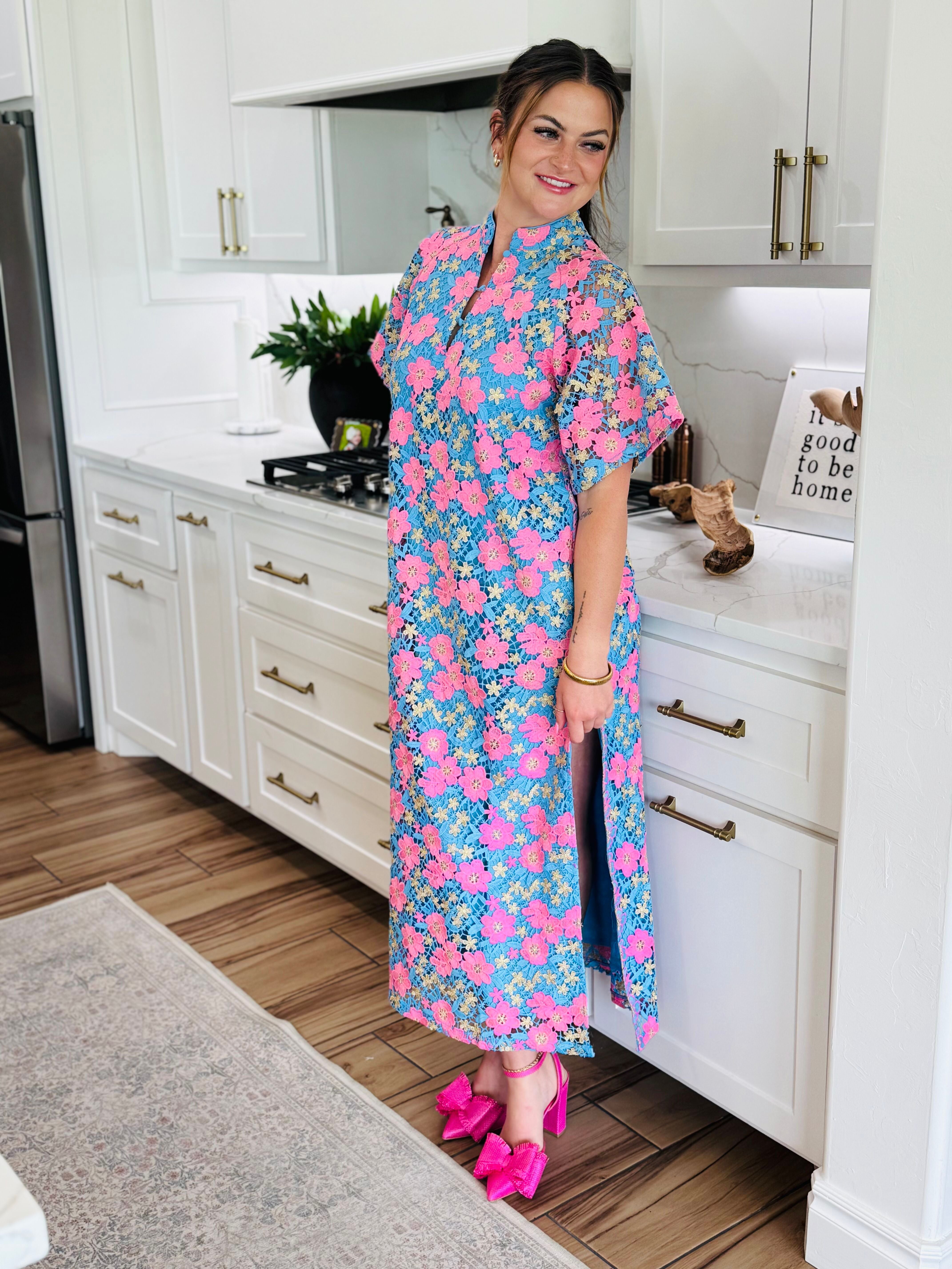Model wearing the LEIGHTON PANSY MAXI DRESS BY BUDDY LOVE, highlighting its elegant two slits and ankle-length silhouette.
