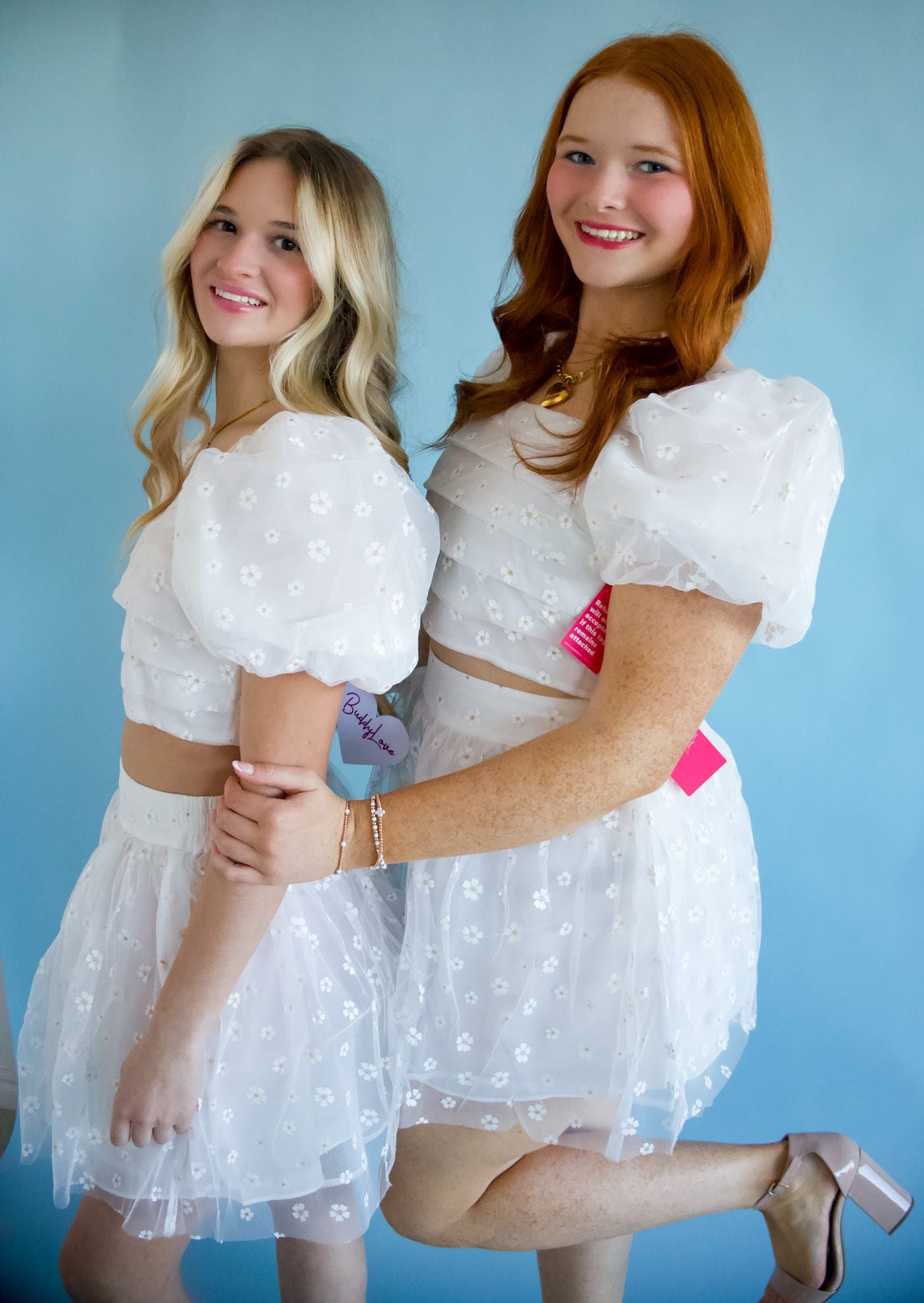Cutie English Daisy White Floral Top and Skirt Set showcasing a puffed sleeve cropped top and high-waisted mini skirt, perfect for brides and graduations.