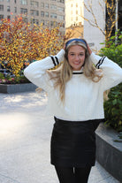 Eye-catching Black Bow Skirt displayed elegantly, highlighting its unique bow feature and sleek silhouette.