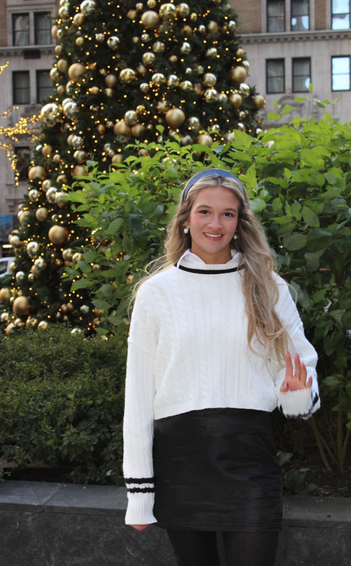 Trendy Black Bow Skirt showcasing its convenient side zip and fashionable design, perfect for elevating your wardrobe.