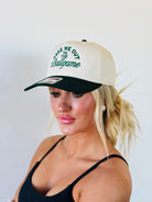 Lifestyle image of the TAKE ME OUT TO THE BALLGAME TRUCKER HAT being worn during a baseball game, showcasing its adventurous spirit.