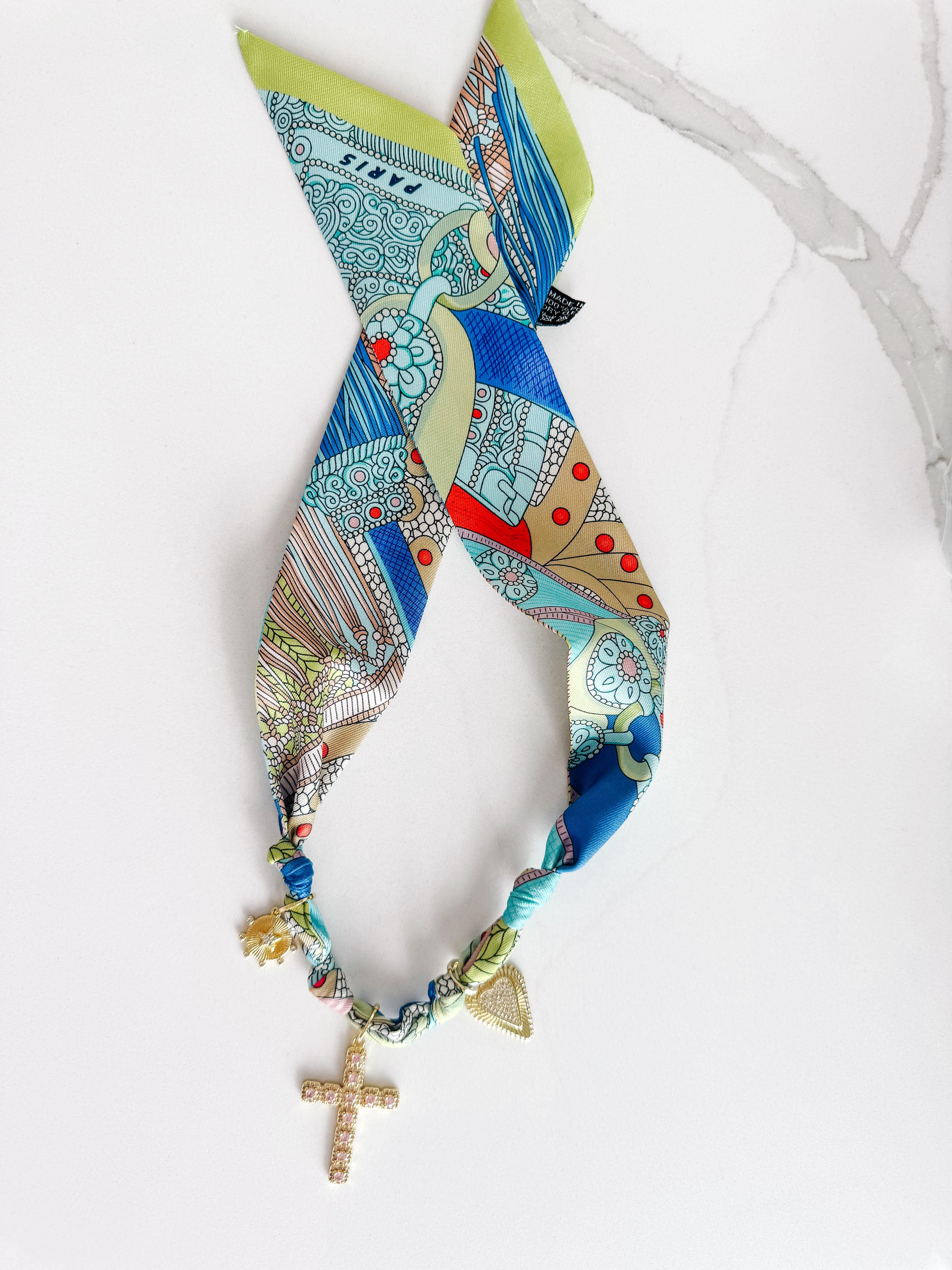 Model wearing the PARIS SCARF NECKLACE, displaying its elegant style and unique design with colorful pendants, suitable for both casual and formal occasions.