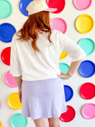 Model wearing Lilac Athletic Skort by Umgee, demonstrating the flattering fit and style suitable for both gym and leisure.