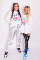 Vintage Rolling Stones concert sweatshirt featuring iconic band photo graphic and 'Live In Concert' text on the back, crafted from soft vintage washed fabric.