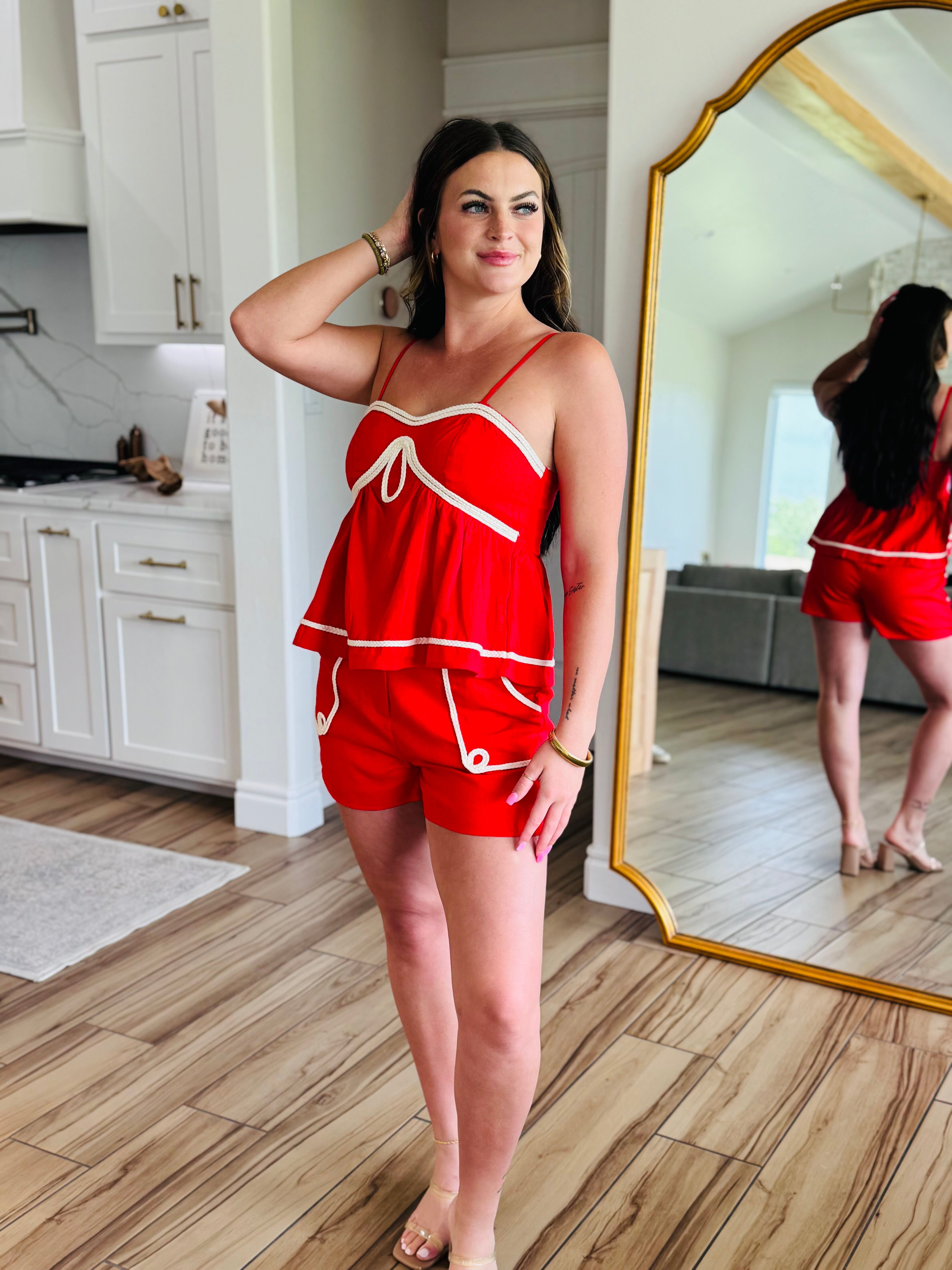 Close-up view of the RED BRAID TRIM DETAIL LINEN SHORT SET, highlighting the spaghetti strap top and elastic back design for a comfortable fit.
