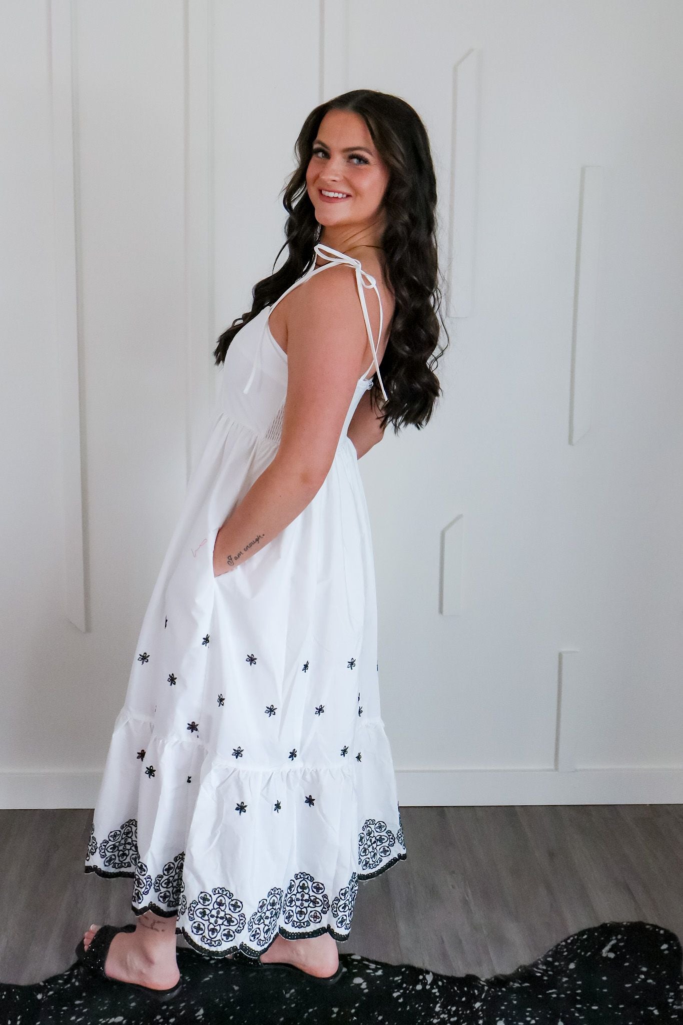 Elegant view of the white and black embroidered maxi by Entro, showcasing its flowy design ideal for beach trips and everyday wear.