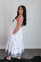 Elegant view of the white and black embroidered maxi by Entro, showcasing its flowy design ideal for beach trips and everyday wear.